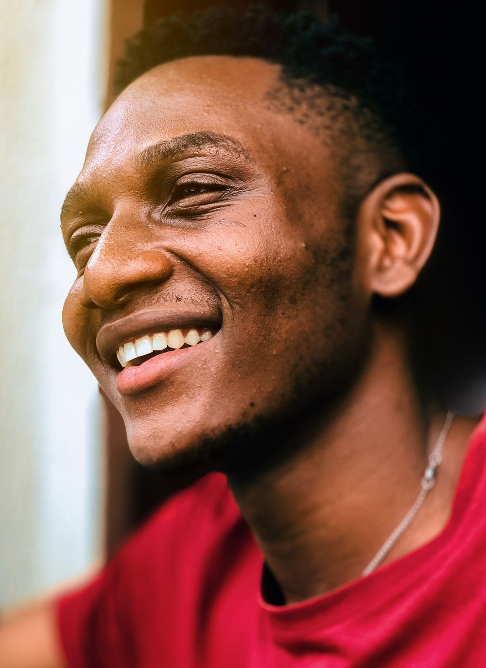 A patient smiling with a straight, healthy smile