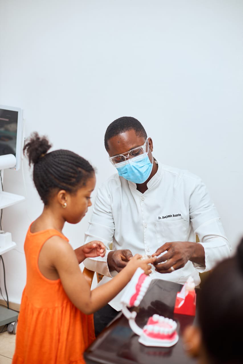 Dr. Asante with a young patient